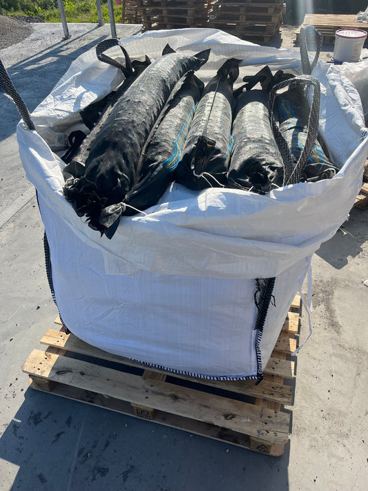 Filled silage bags with pea gravel for sealing silage pits